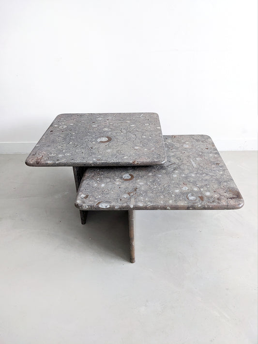 Vintage Design Ammonite fossil Stone nesting tables. Postmodern design from the 1980's. Set of two nesting tables, which slide into each other. Also perfect as coffee table or side table.